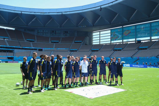 In this handout photo from UEFA players and coaching staff