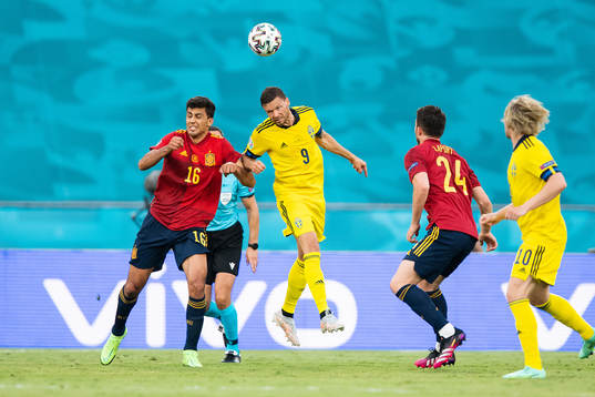 Rodri Rodri of Spain and Marcus Berg of Sweden
