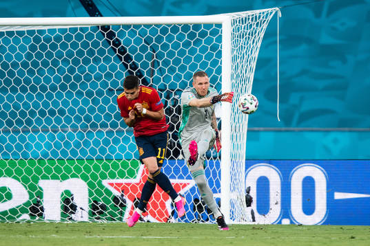 Ferran Torres of Spain and goalkeeper Robin Olsen of Sweden