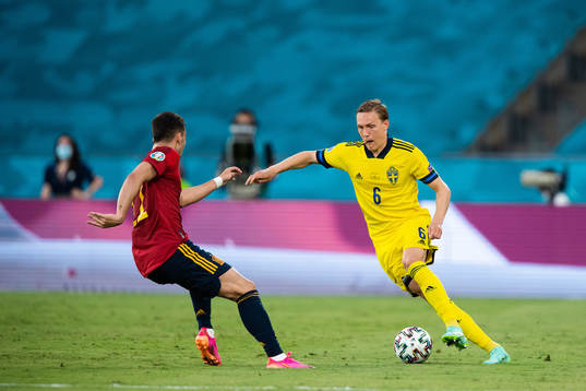 Ferran Torres of Spain and Ludwig Augustinsson of Sweden