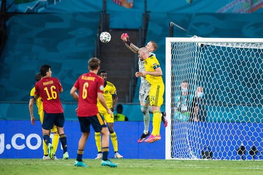 goalkeeper Robin Olsen and Marcus Danielson of Sweden