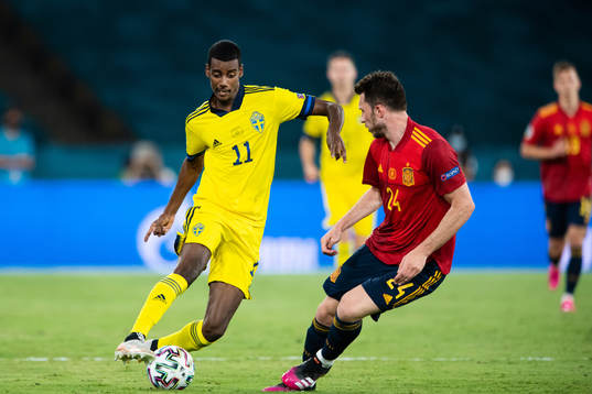 Alexander Isak of Sweden and Aymeric Laporte of Spain