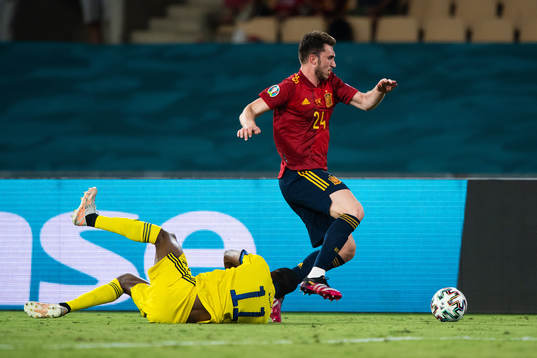 Alexander Isak of Sweden and Aymeric Laporte of Spain