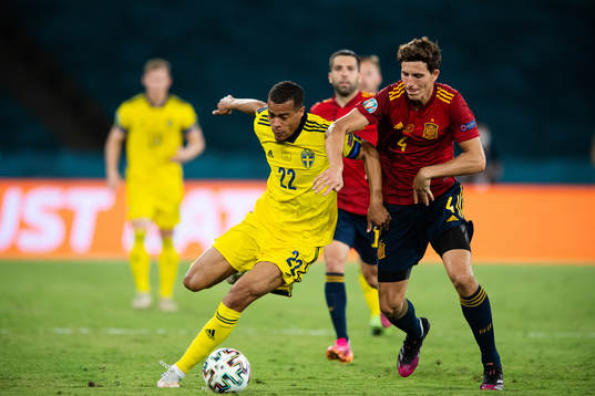 Robin Quaison of Sweden and Aymeric Laporte of Spain