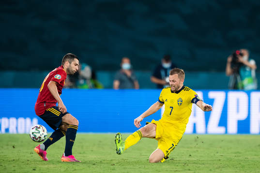 Jordi Alba of Spain and Sebastian Larsson of Sweden
