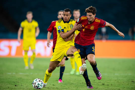 Robin Quaison of Sweden and Aymeric Laporte of Spain