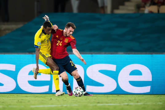 Alexander Isak of Sweden and Aymeric Laporte of Spain
