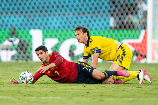 Alvaro Morata of Spain and Albin Ekdal of Sweden