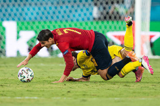 Alvaro Morata of Spain in action against Albin Ekdal of