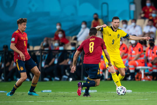 Koke Koke of Spain and Marcus Berg of Sweden