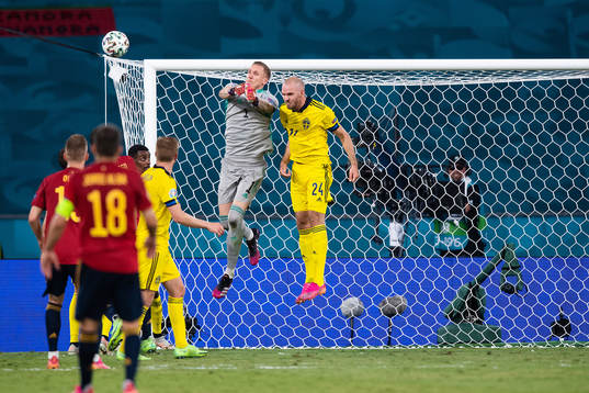 goalkeeper Robin Olsen and Marcus Danielson of Sweden