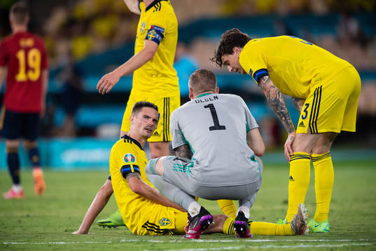 Mikael Lustig of Sweden is injured