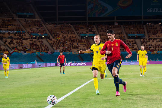 Ludwig Augustinsson of Sweden and Alvaro Morata Álvaro