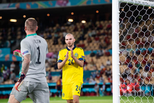 Marcus Danielson and goalkeeper Robin Olsen of Sweden