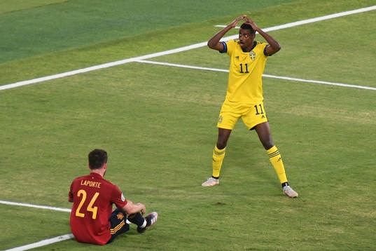 Alexander Isak of Sweden and Aymeric Laporte of Spain