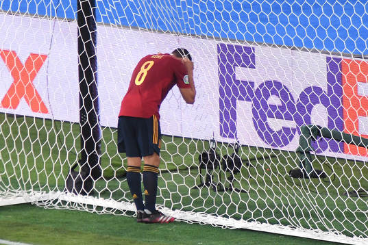 Koke Koke of Spain looks dejected