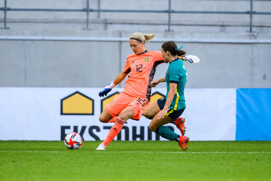 goalkeeper Jennifer Falk of Sweden and Hayley Raso of