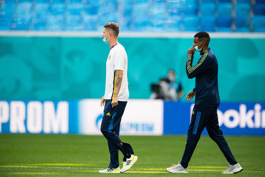 Mikael Lustig and Alexander Isak of Sweden
