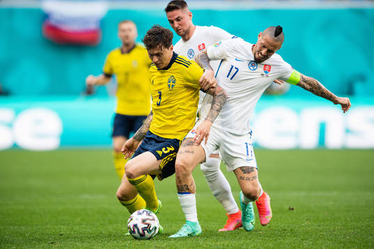 Victor Nilsson Lindelöf of Sweden and Marek Hamsik of