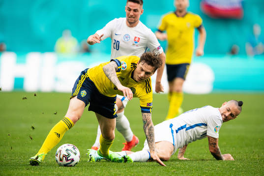 Victor Nilsson Lindelöf of Sweden and Marek Hamsik of