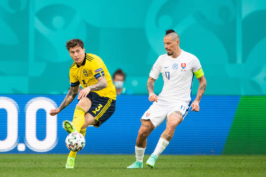 Victor Nilsson Lindelöf of Sweden and Marek Hamsik of