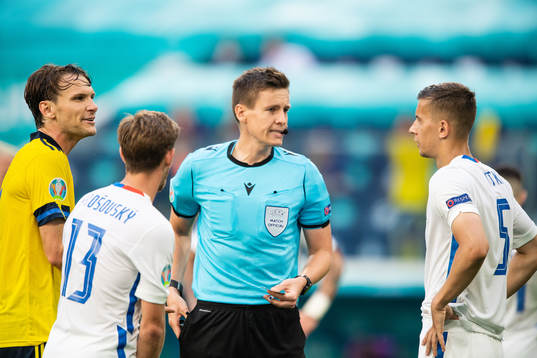 Albin Ekdal of Sweden, referee Daniel Siebert and Patrik