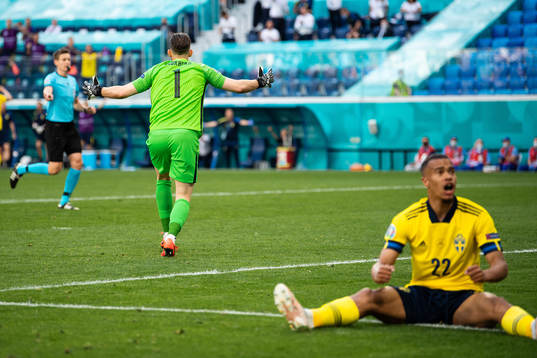 goalkeeper Martin Dubravka of Slovakia and Robin Quaison of