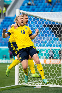 Emil Forsberg and Viktor Claesson of Sweden celebrate
