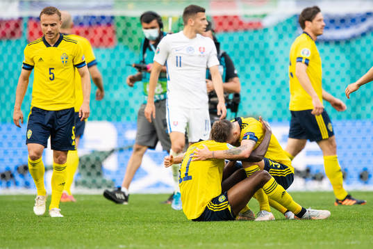 Alexander Isak and Mikael Lustig of Sweden celebrate