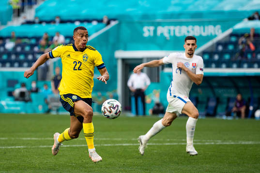Robin Quaison of Sweden and Martin Koscelnik of Slovakia