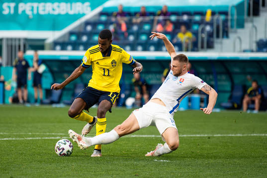 Alexander Isak of Sweden and Milan Skriniar of Slovakia