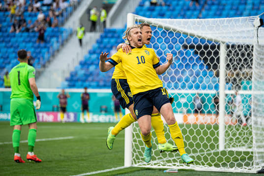Emil Forsberg and Viktor Claesson of Sweden celebrate the