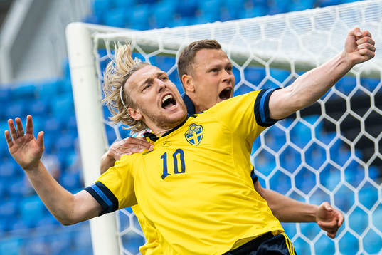 Emil Forsberg and Viktor Claesson of Sweden celebrate the