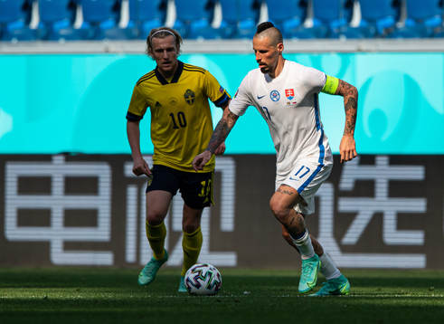 Emil Forsberg of Sweden and Marek Hamsik of Slovakia