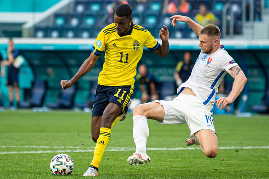 Alexander Isak of Sweden and Milan Skriniar of Slovakia