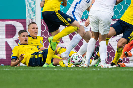 Mikael Lustig and Ludwig Augustinsson of Sweden see players