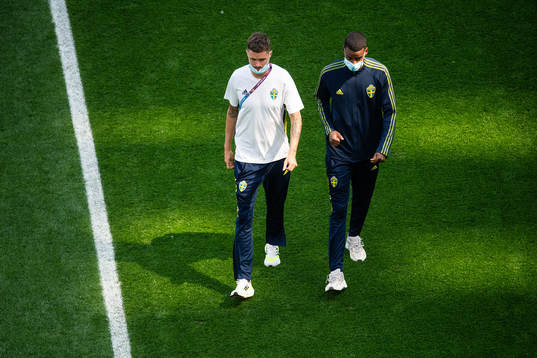Mikael Lustig and Alexander Isak of Sweden
