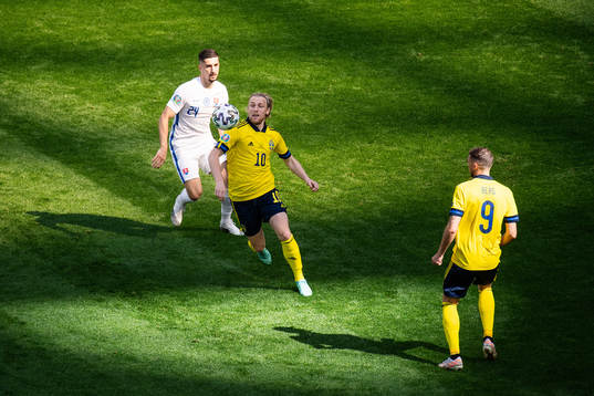 Emil Forsberg of Sweden and Martin Koscelnik of Slovakia