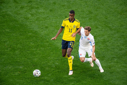 Alexander Isak of Sweden and Patrik Hrosovsky of Slovakia