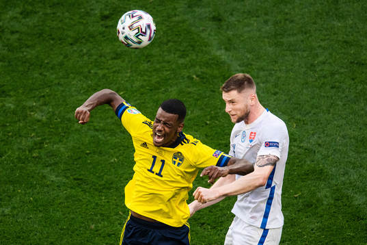 Alexander Isak of Sweden and Milan Skriniar of Slovakia