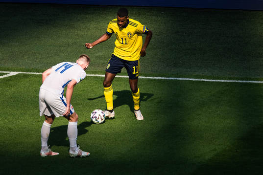 Alexander Isak of Sweden and Milan Skriniar of Slovakia