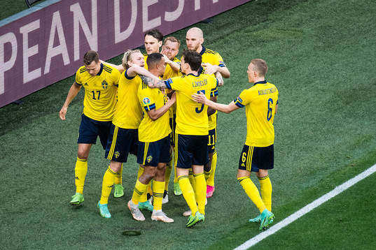Players of Sweden celebrate with Emil Forsberg