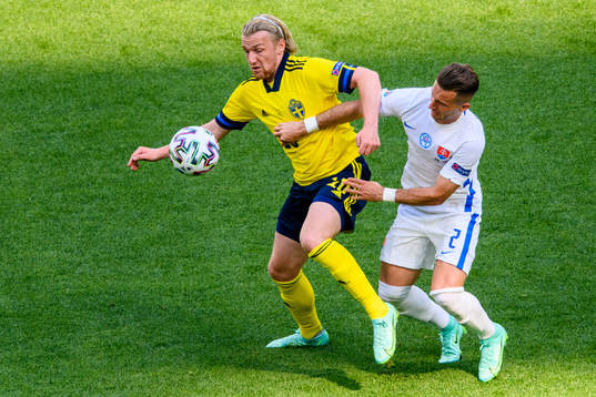 Emil Forsberg of Sweden and Peter Pekarik of Slovakia