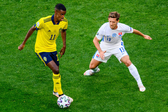 Alexander Isak of Sweden and Patrik Hrosovsky of Slovakia