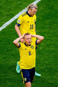 Ludwig Augustinsson and Emil Forsberg of Sweden looks