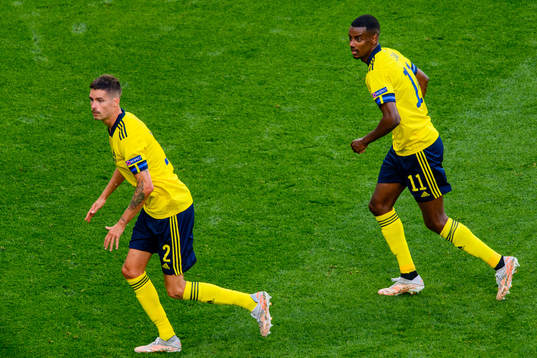 Mikael Lustig and Alexander Isak of Sweden