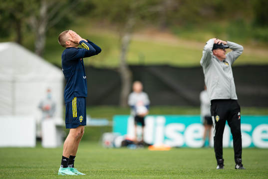 Ludwig Augustinsson and head coach Janne Andersson of the
