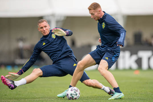 Goalkeeper Robin Olsen and Dejan Kulusevski of the Swedish