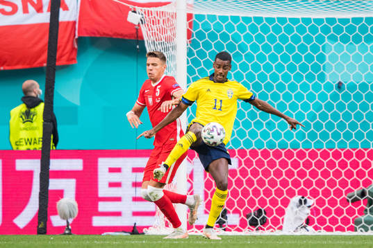 Jan Bednarek of Poland and Alexander Isak of Sweden