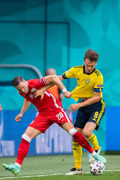 Piotr Zielinski of Poland and Albin Ekdal of Sweden